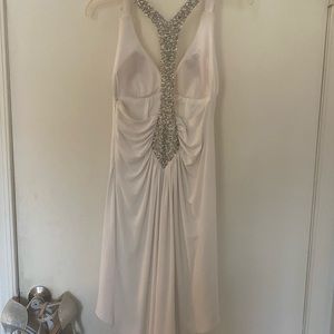White cocktail dress.  Sequins tee back.